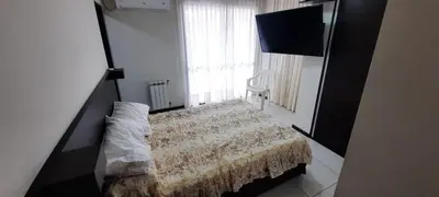 a small bedroom with a bed and a window at Miralejos 7 Music in Villa Carlos Paz