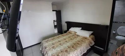 a small bedroom with a bed with two pillows at Miralejos 7 Music in Villa Carlos Paz