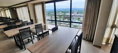 a conference room with a table and chairs and a large window at Miralejos 7 Music in Villa Carlos Paz