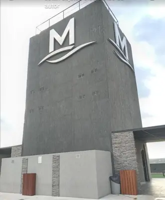 a building with aundai sign on the side of it at Miralejos 7 Music in Villa Carlos Paz