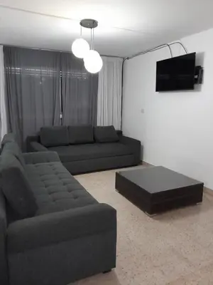 a living room with a couch and a coffee table at M65 Luxury Suit in Cordoba