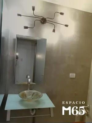 a bathroom with a sink and a mirror at M65 Luxury Suit in Cordoba