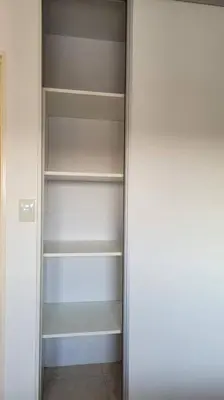 a closet with empty shelves in a room at Departamento Quirós in Cordoba