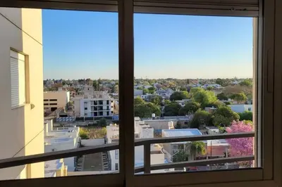 a view of a city from a window at Departamento Quirós in Cordoba