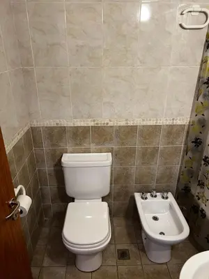 a bathroom with a toilet and a sink at San Lorenzo 137 in Cordoba
