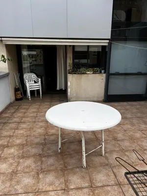 a white table sitting on top of a floor at San Lorenzo 137 in Cordoba