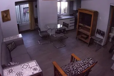 a living room with a couch and a table and chairs at Monoambiente super funcional! in Cordoba