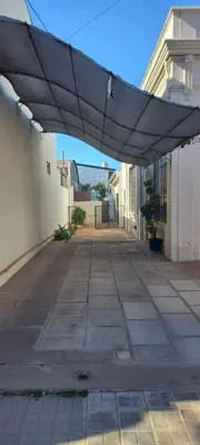 awning over an empty sidewalk in a building at Departamento Alta Gracia in Alta Gracia