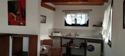 a kitchen with a sink and a window at Los Ceibos Suites in Villa Ciudad de America