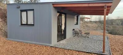 a tiny house sitting on top of a hill at Los Ceibos Suites in Villa Ciudad de America