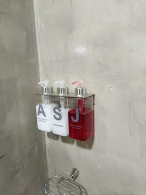 a wall with two bottles on a wall at Apart Suite Premiun in Villa Carlos Paz