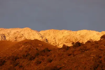 a group of mountains with trees in front of them at Apart Loma Linda in Merlo