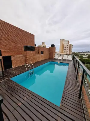 a swimming pool on the roof of a building at Departamento Scala in Cordoba
