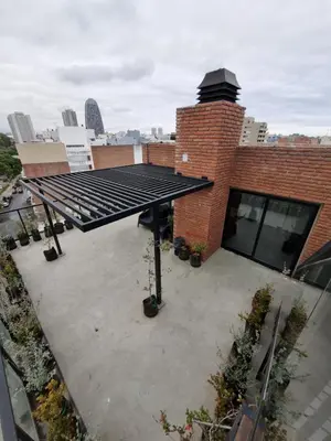 a group of solar panels on top of a building at Departamento Scala in Cordoba