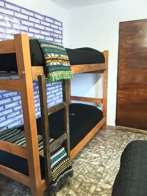 a couple of bunk beds in a room at El kincho hostel bike in La Cruz