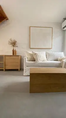 a living room with a couch and a table at Duplex en el Cerro de Las Rosas by Lugar in Cordoba