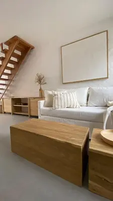 a living room with a couch and a coffee table at Duplex en el Cerro de Las Rosas by Lugar in Cordoba