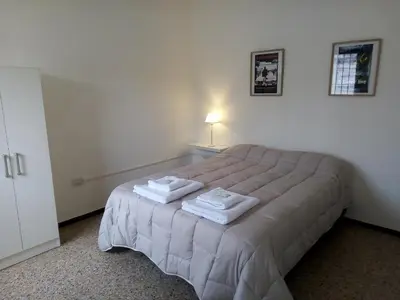 a bedroom with a bed with towels on it at Urquiza - Habitación para turistas in Cordoba