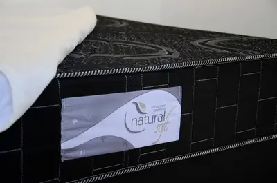 a box of natal oil sitting on top of a bed at Urquiza - Habitación para turistas in Cordoba
