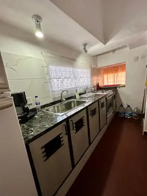 a kitchen with a sink and a counter top at La Soñada in Alta Gracia