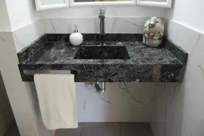 a bathroom counter with a sink and a towel at Reina Paz in Cordoba
