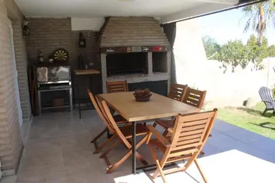 a kitchen and dining room with a table and chairs at Reina Paz in Cordoba