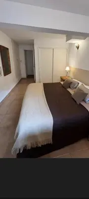 a bedroom with a large bed in a room at Reina Paz in Cordoba