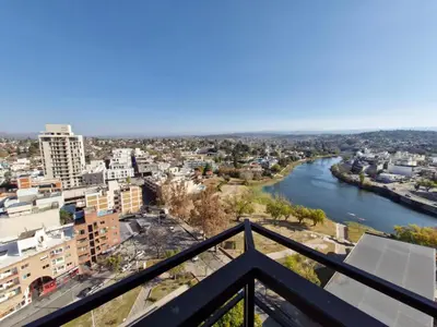 a view of a river from a balcony at Departamento Acuario II - a metros del shopping woo in Villa Carlos Paz