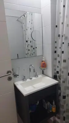 a bathroom with a white sink and a mirror at Cañada in Cordoba