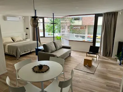 a living room with a couch and a table at Departamento Blue - Piso 1 Laprida Once in Cordoba