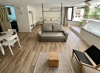 a living room with a couch and a table at Departamento Blue - Piso 1 Laprida Once in Cordoba