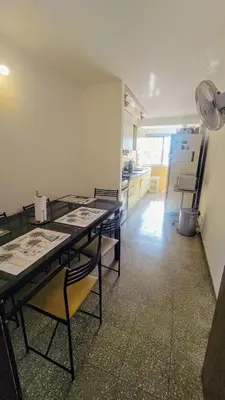 a room with a table and chairs in a kitchen at Habitación silenciosa Nº2 en Dpto Compartido in Cordoba