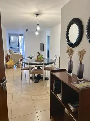 a living room with a table and a dining room at Independencia Housing in Cordoba