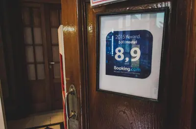 a sign on the door of a room at 531 Hostel in Cordoba