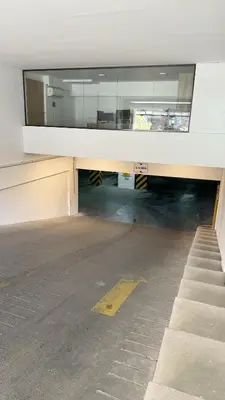 an empty parking lot in an empty building at Eloise II, excelente ubicación y con todo lo que necesitas! in Villa Carlos Paz