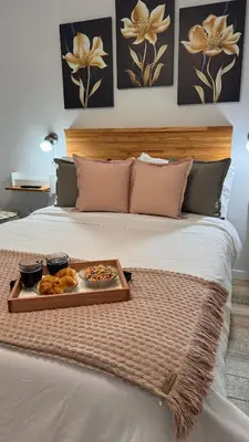 a tray of food sitting on top of a bed at Eloise II, excelente ubicación y con todo lo que necesitas! in Villa Carlos Paz
