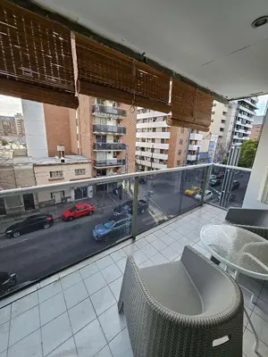 a balcony with a view of a city with cars on the street at Picasso Nueva Cordoba in Cordoba