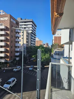 a view from a window of a city street with cars at Picasso Nueva Cordoba in Cordoba