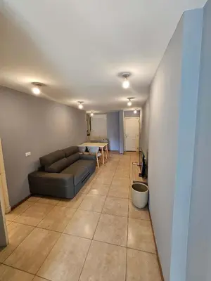 a living room with a couch and a table at Picasso Nueva Cordoba in Cordoba
