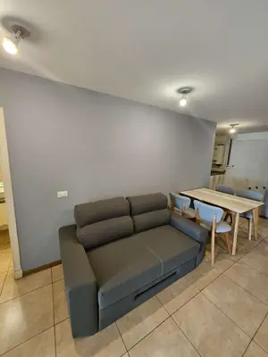 a living room with a couch and a table at Picasso Nueva Cordoba in Cordoba