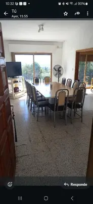 a dining room with a table and chairs at Mágico atardecer in Villa Carlos Paz