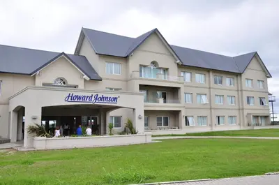 a large building with a sign that reads banquet center at Howard Johnson Hotel Piedras Moras in Almafuerte