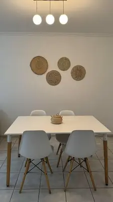 a white table with four chairs in a room at Oak Home en Nva Cba in Cordoba