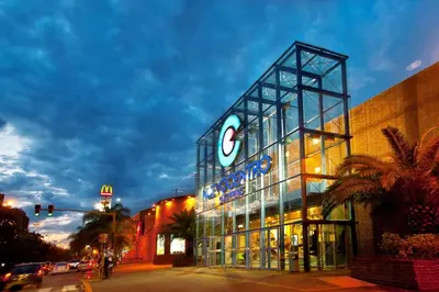 a building with a sign on the side of a street at FTE HOTEL QUINTO CENTENARIO NUEVOCENTRO shopping LUMINOSO DTO EXCELENTE VISTA 1 dor in Cordoba