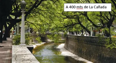a sign that reads a miles of la cartilla next to a river at Departamento en el centro in Cordoba