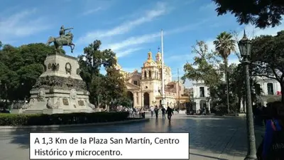 a plaza with a statue in front of a building at Departamento en el centro in Cordoba