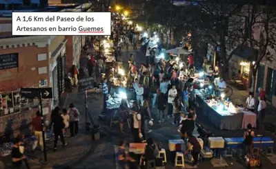 a crowd of people in a street at an outdoor market at Departamento en el centro in Cordoba