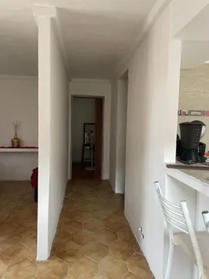 a hallway of a house with a table and a chair at Casa en San Francisco del monte de oro in San Francisco del Monte de Oro
