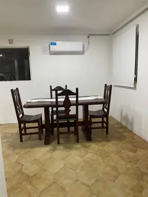 a dining room with a table and chairs and a fan at Casa en San Francisco del monte de oro in San Francisco del Monte de Oro