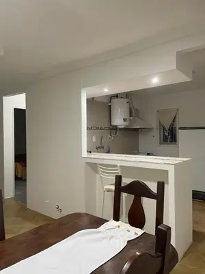 a kitchen with a table and a counter top at Casa en San Francisco del monte de oro in San Francisco del Monte de Oro